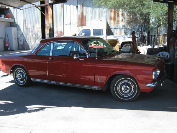 passenger side of red classic car with custom paint job in florence Arizona