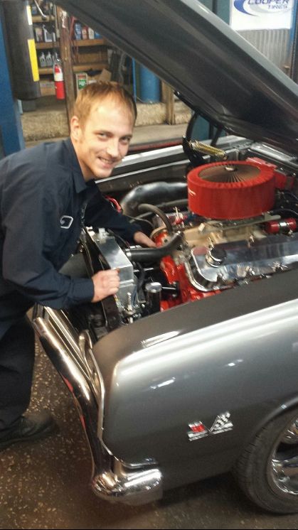 mechanic installing new engine