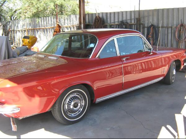 rear passenger side of red classic car with custom paint job in florence Arizona