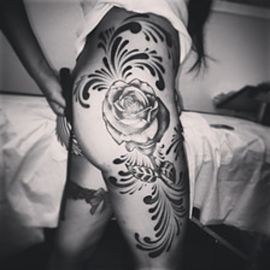 professional tattoo on thigh