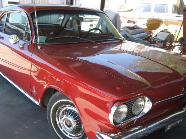 front passenger side of red classic car with custom paint job in florence Arizona