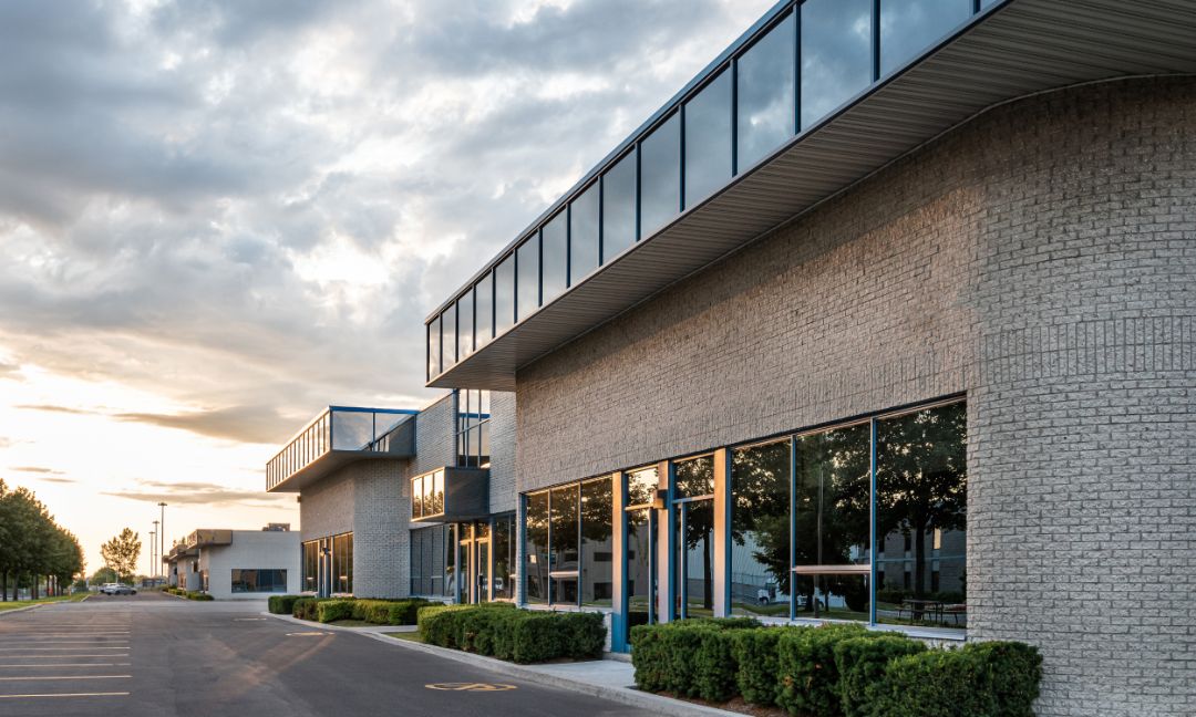 ensurity group, insurance agency, texas estados unidos, tall window buildings full of windows from a  bottom view and clear blue sky