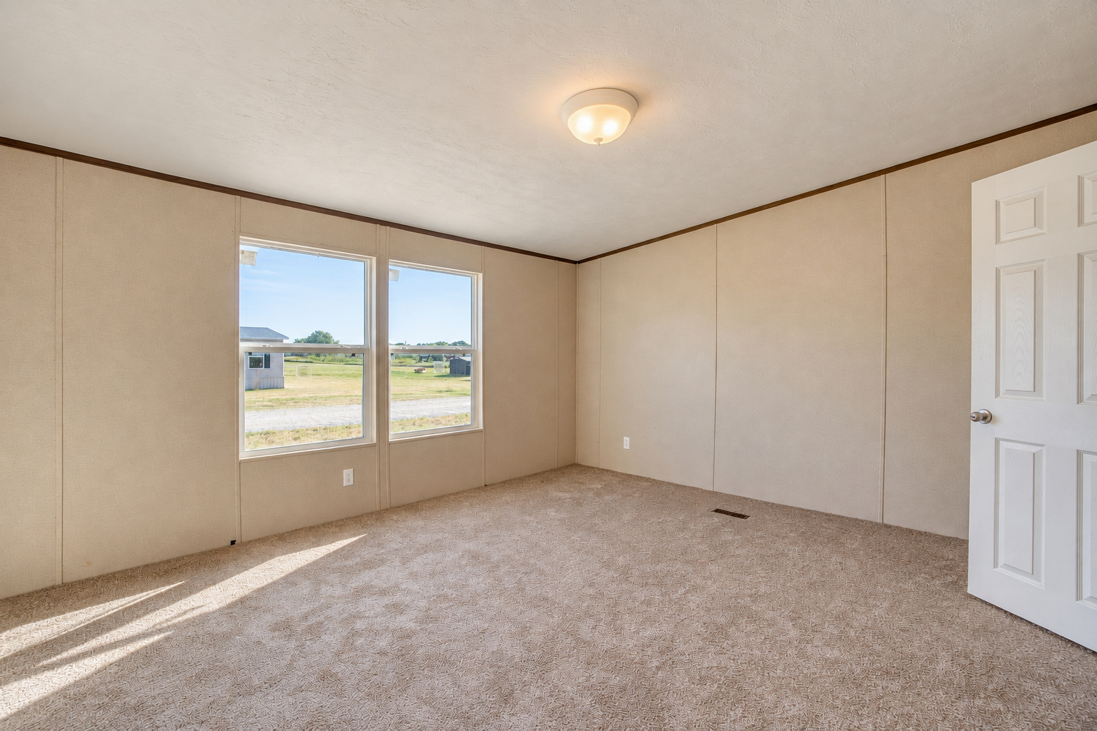 Spacious carpeted bedroom with double windows - 215 Cale Lane, Calera OK