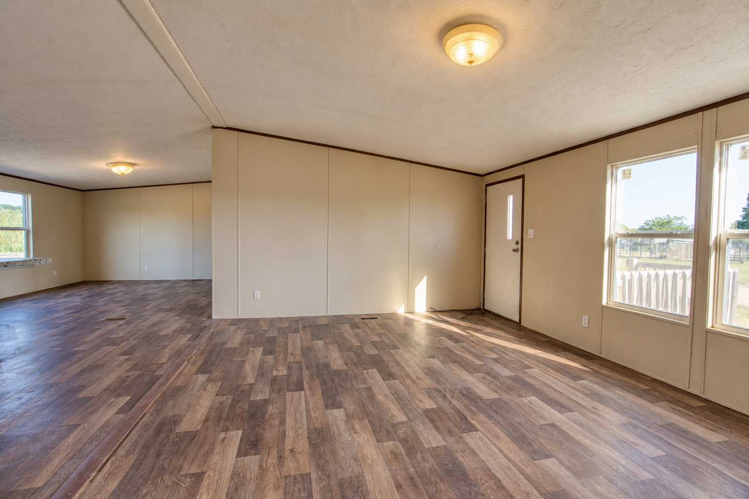 Living room with natural light and front entry - 215 Cale Lane, Calera OK