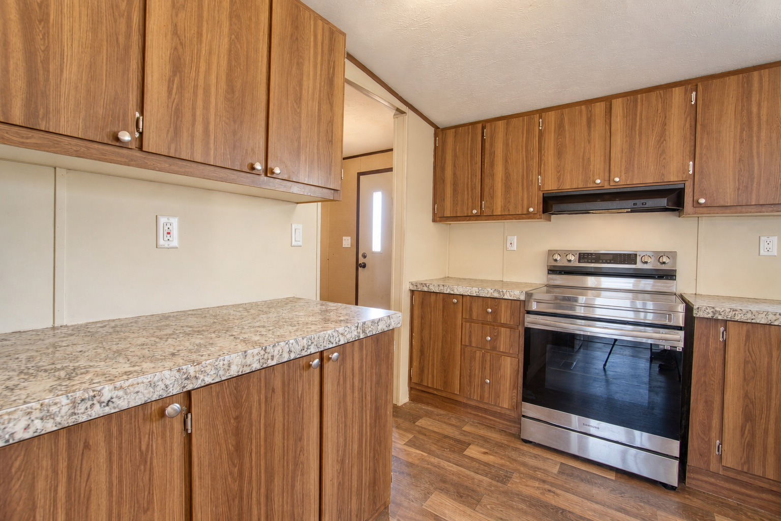 Stainless electric range with ample cabinet space - 215 Cale Lane, Calera OK