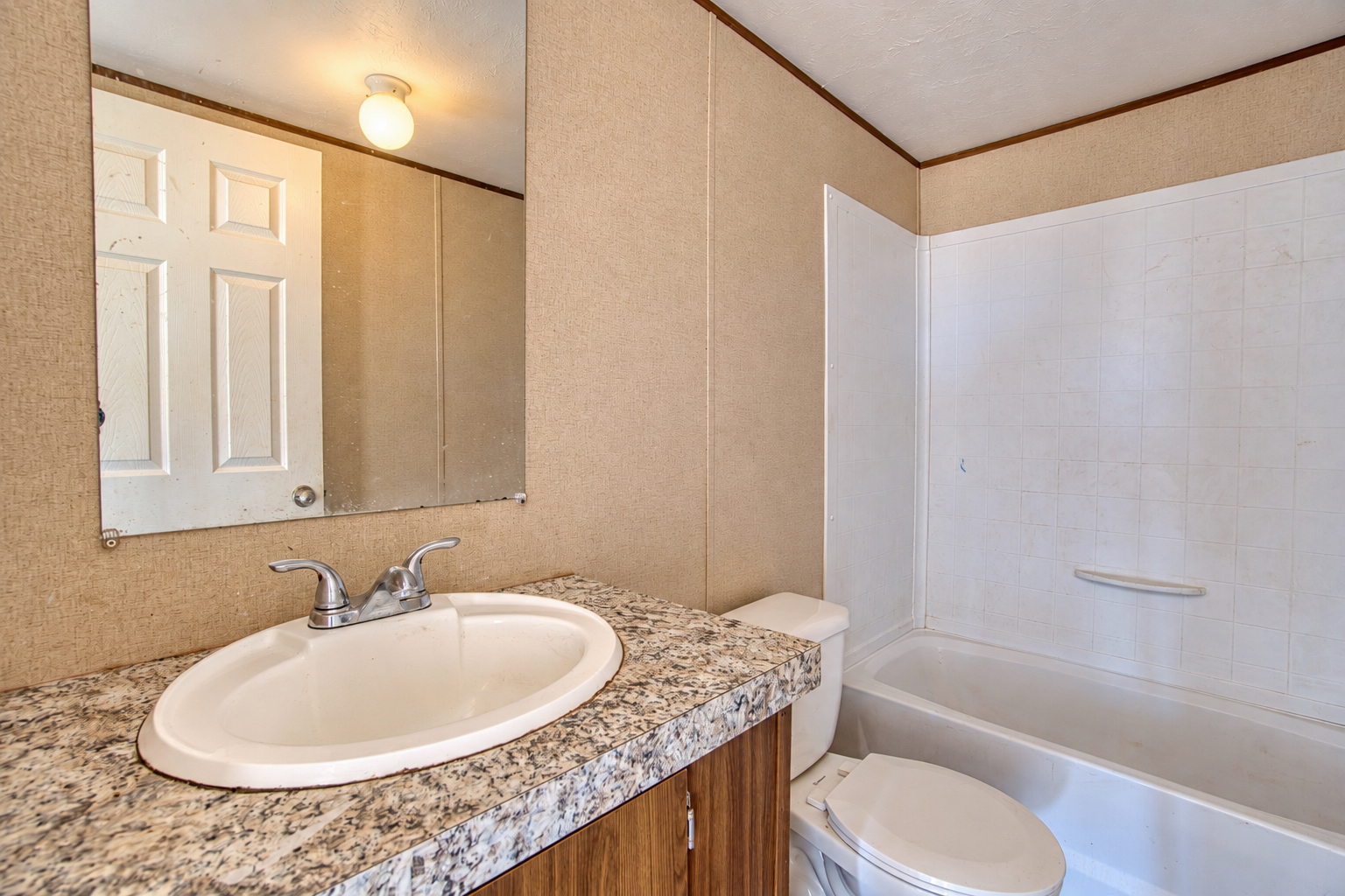 Second bathroom with vanity and tub-shower combo - 215 Cale Lane, Calera OK