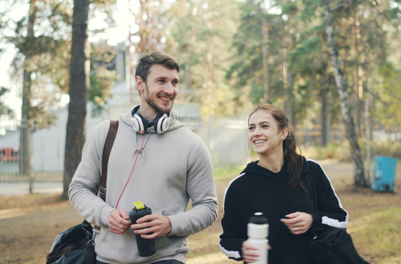 Two people walking together, relaxed and smiling