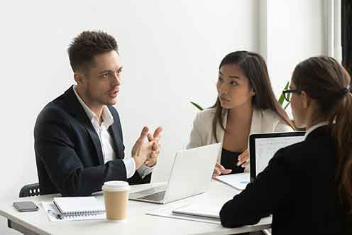concentrated-coworkers-discussing-company-business-strategies