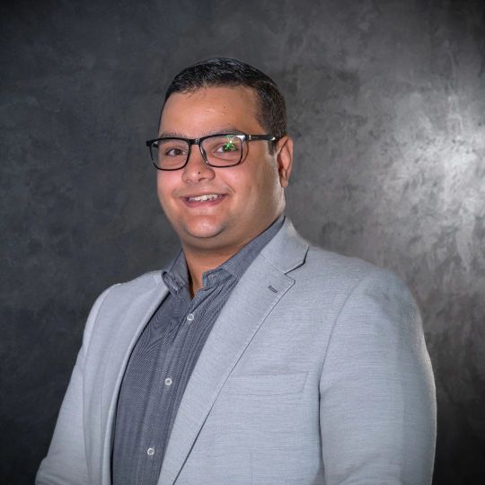 Technical sales team leader of Reyada in professional business attire portrait