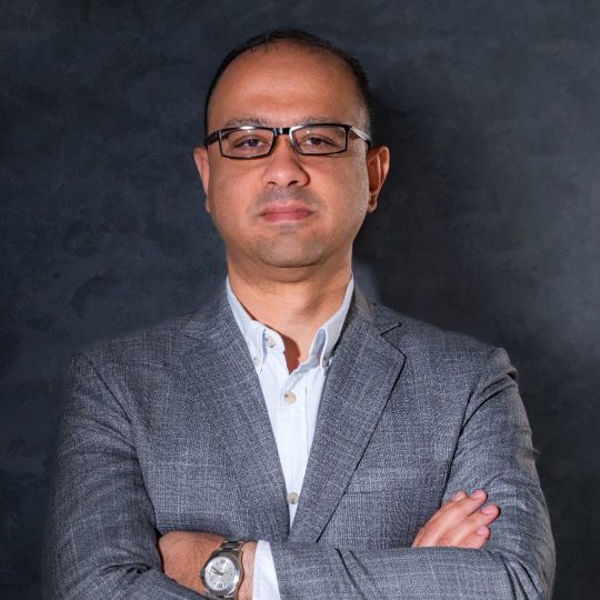 CEO of Reyada in professional business attire portrait