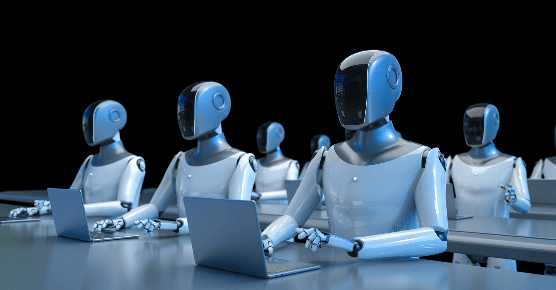 Humanoid robots working on laptops representing Reyada's RPA and AI automation in business