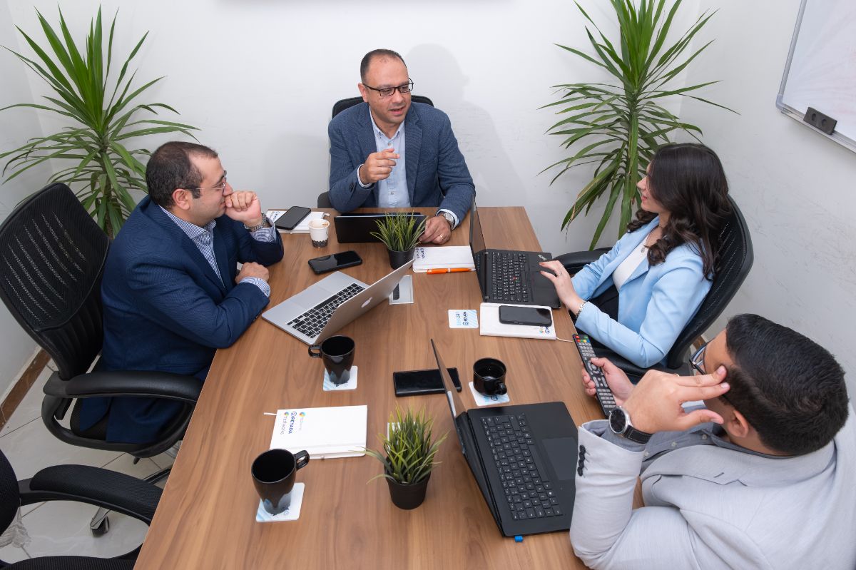 Reyada consulting team in strategy meeting discussing digital transformation solutions